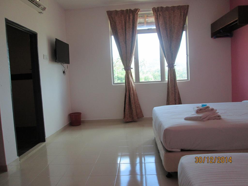 Oyo 275 Senyum Inn Pantai Cenang  Habitación foto